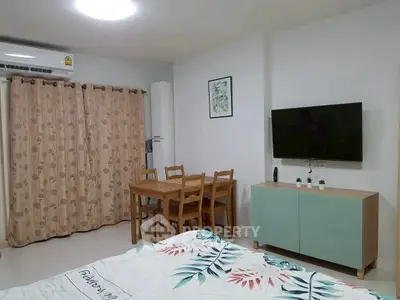 Cozy modern living room with dining area and wall-mounted TV