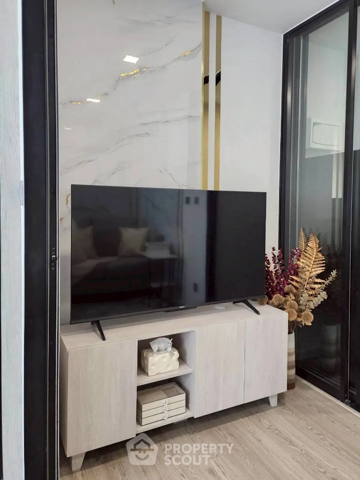 Modern living room with sleek TV setup and elegant decor