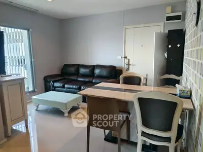 Modern living room with sleek furniture and stylish decor in a cozy apartment.