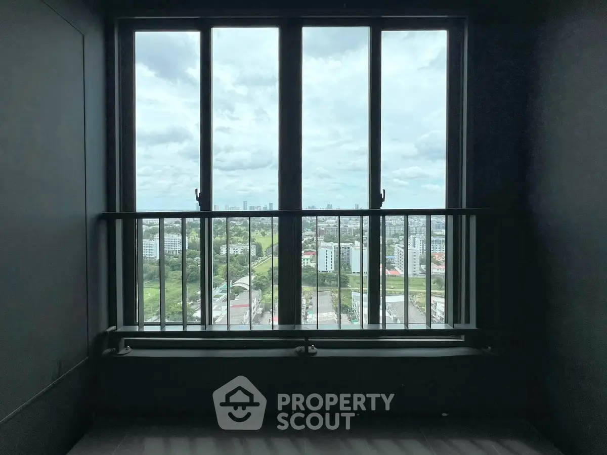 Stunning cityscape view from a modern apartment window, showcasing urban living at its finest.