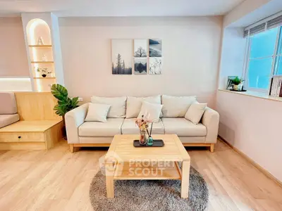 Modern living room with cozy beige sofa and stylish decor
