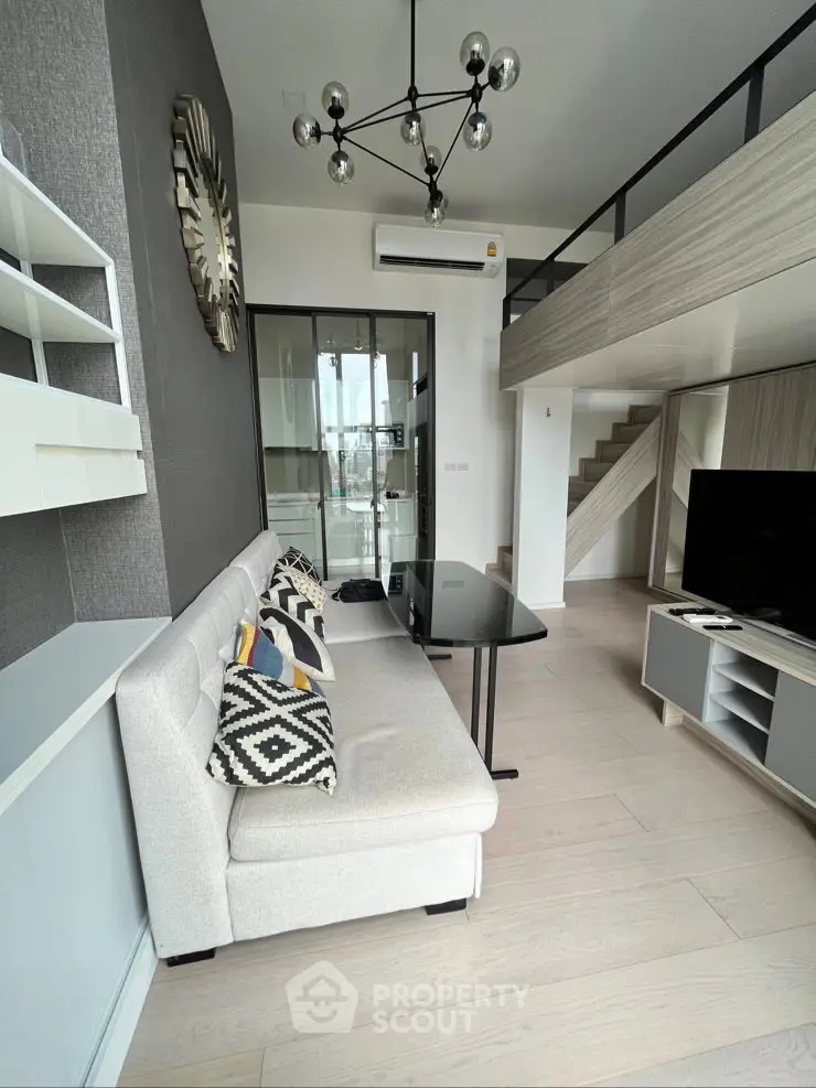 Modern loft-style living room with sleek design and mezzanine level