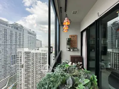 Stunning high-rise balcony with lush greenery and panoramic city views.