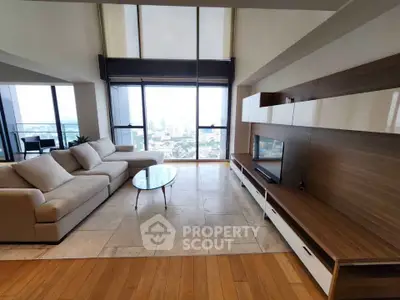 Spacious modern living room with panoramic city view and elegant furnishings.