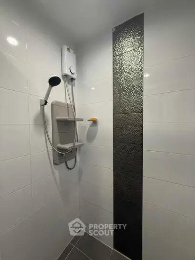 Modern bathroom with sleek shower design and stylish tile accents
