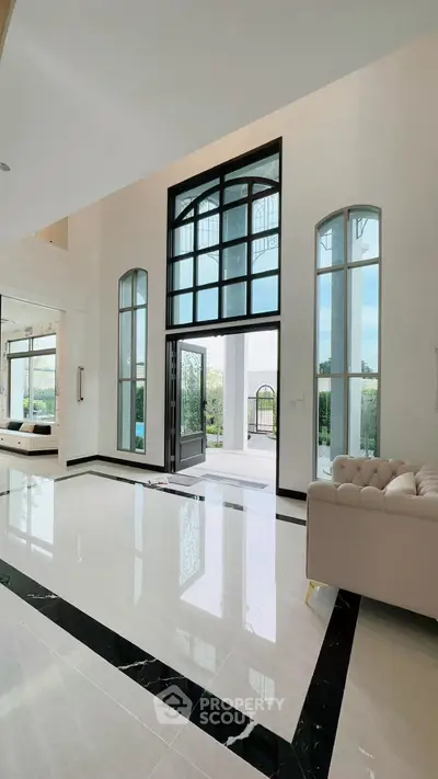 Luxurious entrance with high ceilings and elegant design in a modern home