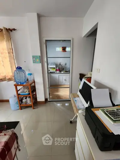 Cozy interior with open layout kitchen and natural light, ideal for modern living.