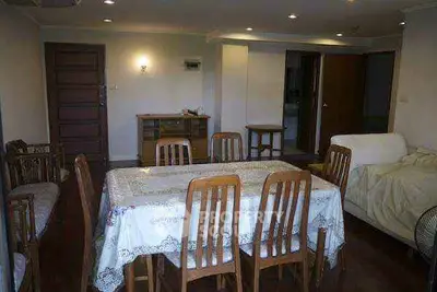 Spacious dining area with wooden furniture and cozy lighting