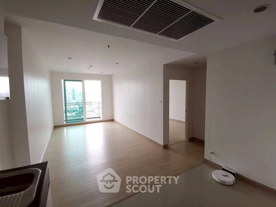Spacious unfurnished apartment with balcony and modern flooring