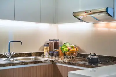 Modern kitchen with sleek countertops and fresh produce display