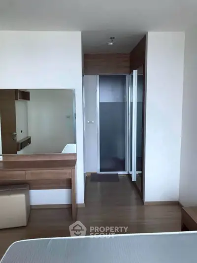 Modern bedroom with sleek wooden furniture and minimalist design