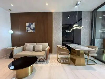 Luxurious modern living room with elegant dining area and stylish lighting fixtures.
