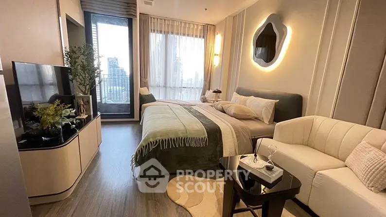 Modern bedroom with city view, stylish decor, and cozy seating area.