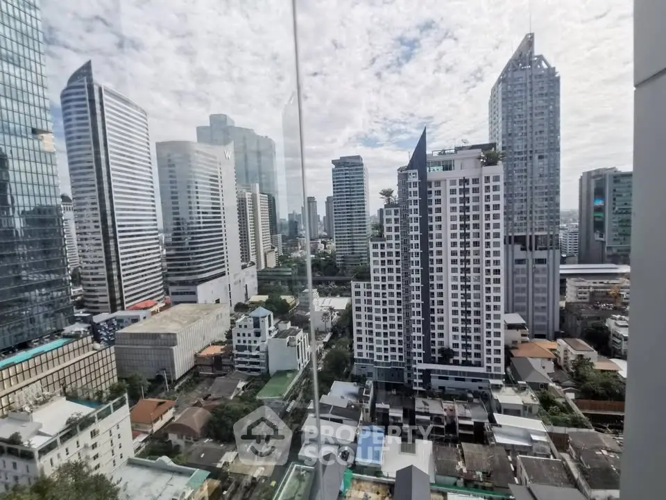 Stunning cityscape view from high-rise building showcasing modern urban skyline.