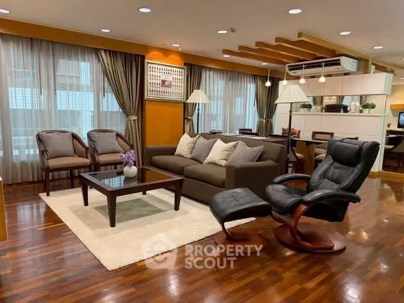 Luxurious living room with elegant furniture and hardwood floors in modern apartment.