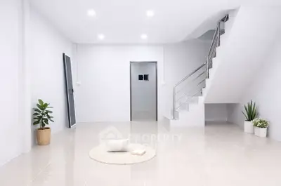 Minimalist modern interior with sleek staircase and bright lighting