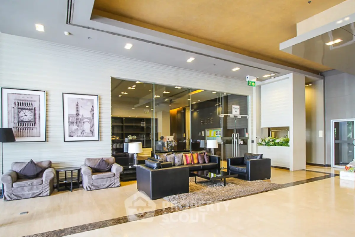 Luxurious modern lobby with stylish seating and elegant decor in a high-end building.
