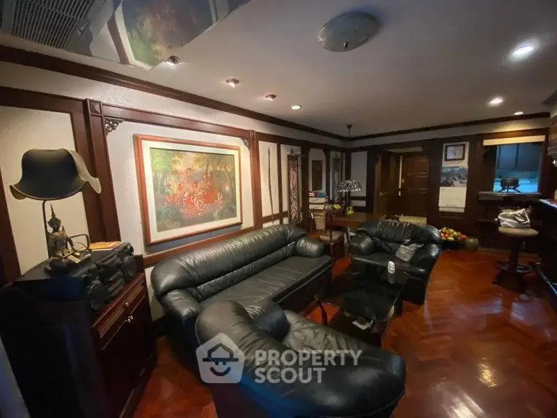 Luxurious living room with elegant leather sofas and exquisite wood flooring