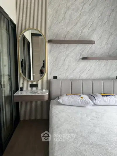 Luxurious modern bedroom with elegant decor and stylish mirror