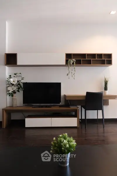 Modern living room with sleek TV unit and stylish desk setup