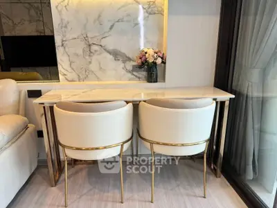 Elegant living room with marble accents and plush seating