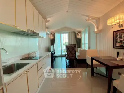 Charming open-layout kitchen and living area with elegant decor and natural light