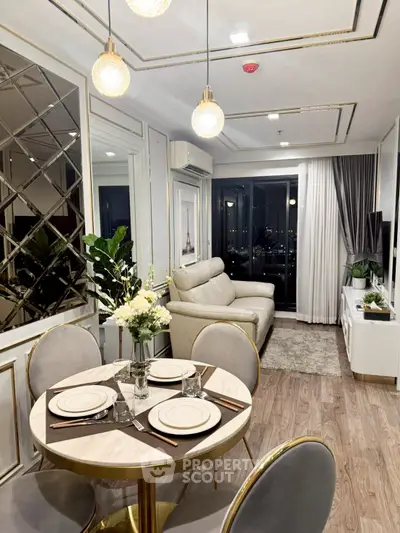 Elegant living room with modern decor and city view, featuring a cozy dining area and stylish lighting.