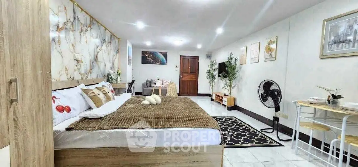 Spacious and stylish bedroom with modern decor and cozy ambiance