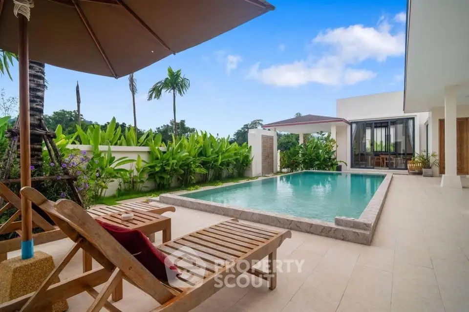 Luxurious villa with private pool and lush garden, perfect for tropical living.