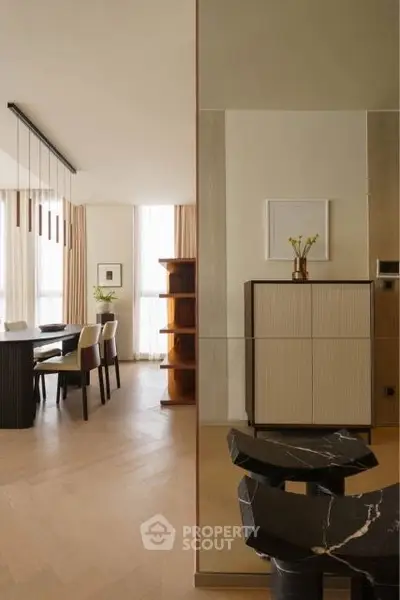 Elegant modern living room with stylish dining area and chic decor