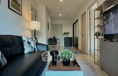 Modern living room with stylish decor and cozy seating area in a contemporary apartment.