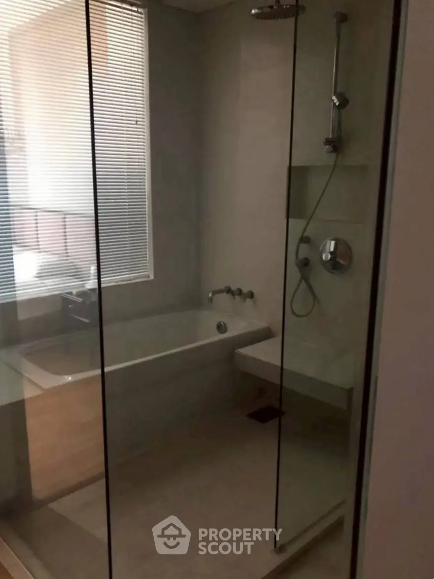 Modern bathroom with glass shower and bathtub