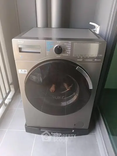 Modern washing machine on a balcony in a contemporary apartment.