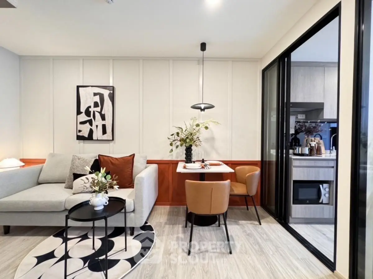 Modern living room with stylish decor and open kitchen layout