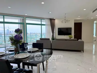 Luxurious living room with panoramic city view and elegant dining area