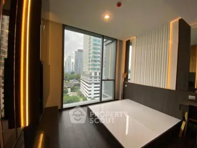 Modern high-rise apartment with floor-to-ceiling windows and city view