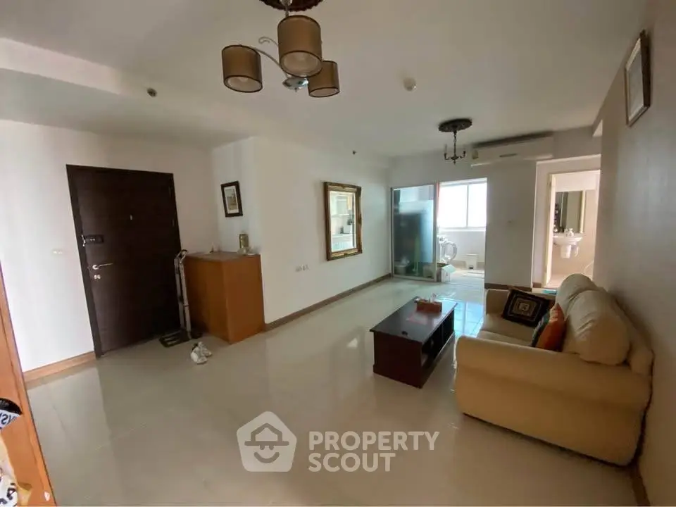 Spacious living room with modern decor and ample natural light