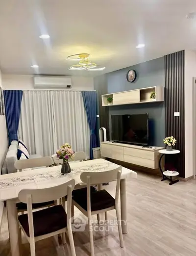 Modern living room with stylish decor, open layout, and elegant lighting, perfect for cozy family gatherings.