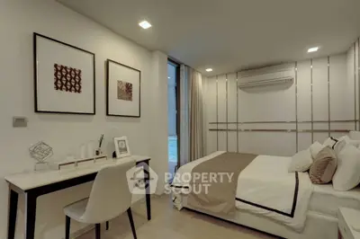 Modern bedroom with stylish decor and workspace, featuring elegant lighting and a cozy atmosphere.