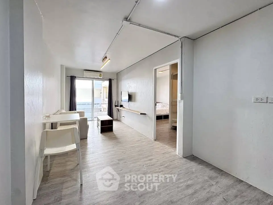 Modern minimalist apartment with open layout and sleek flooring