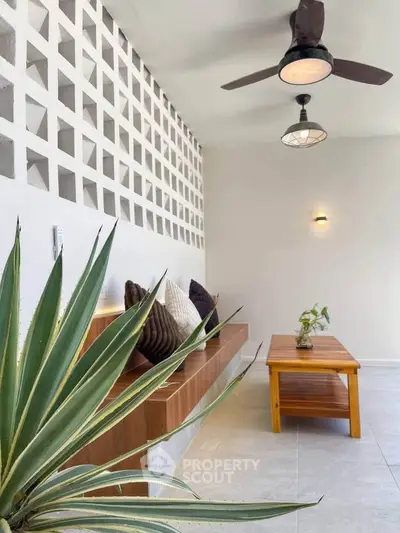 Stylish modern living area with unique wall design and cozy seating