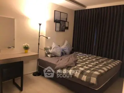 Cozy bedroom with modern decor and soft lighting, featuring a comfortable bed and stylish furnishings.