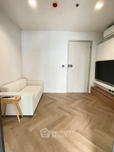 Modern living room with minimalist design and wooden flooring