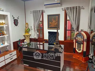 Charming home office with elegant decor and vintage jukebox, perfect for productivity and style.