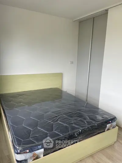 Modern bedroom with new mattress and sliding closet doors