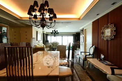 Luxurious living room with elegant chandelier and marble dining table