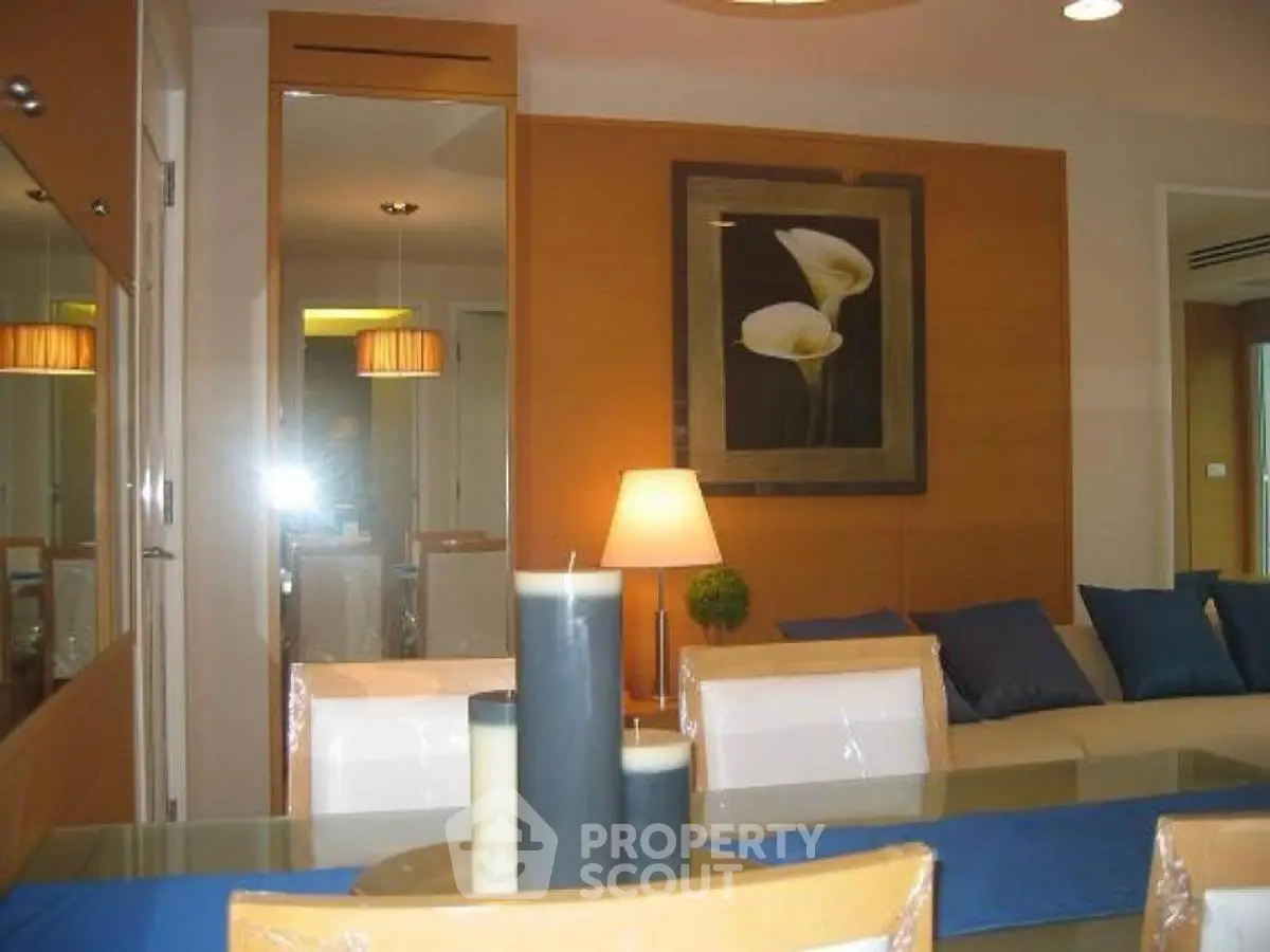 Stylish modern living room with elegant decor and cozy seating area.