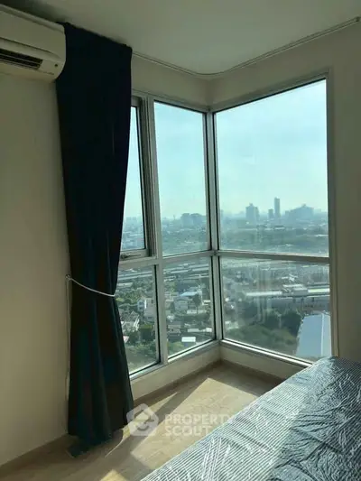 Corner bedroom with panoramic city view and large windows