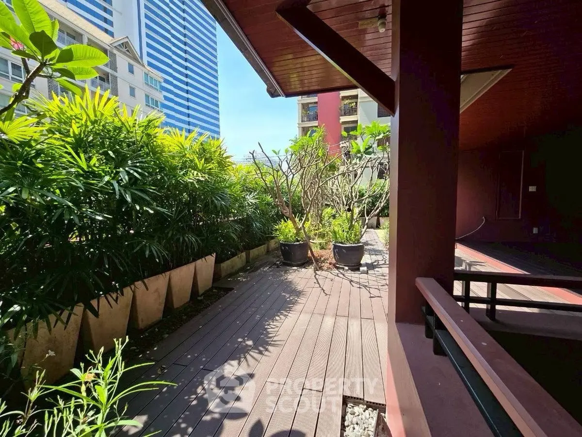 Charming urban garden terrace with lush greenery and modern architecture, perfect for relaxation and outdoor enjoyment.