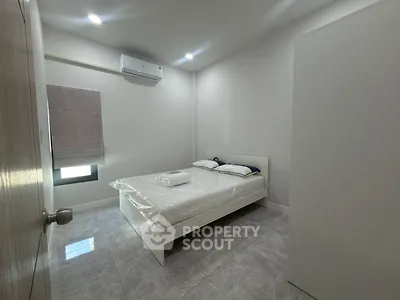 Modern minimalist bedroom with air conditioning and sleek design